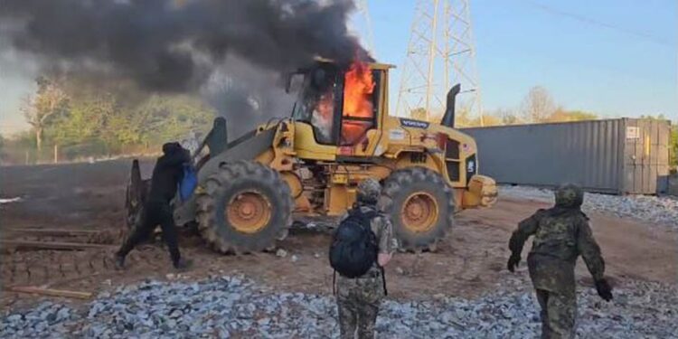 35 arrested after rioters set fire to construction equipment, attack police (Update)